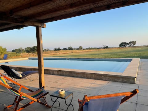 An old mill between the sea and the countryside with a swimming pool