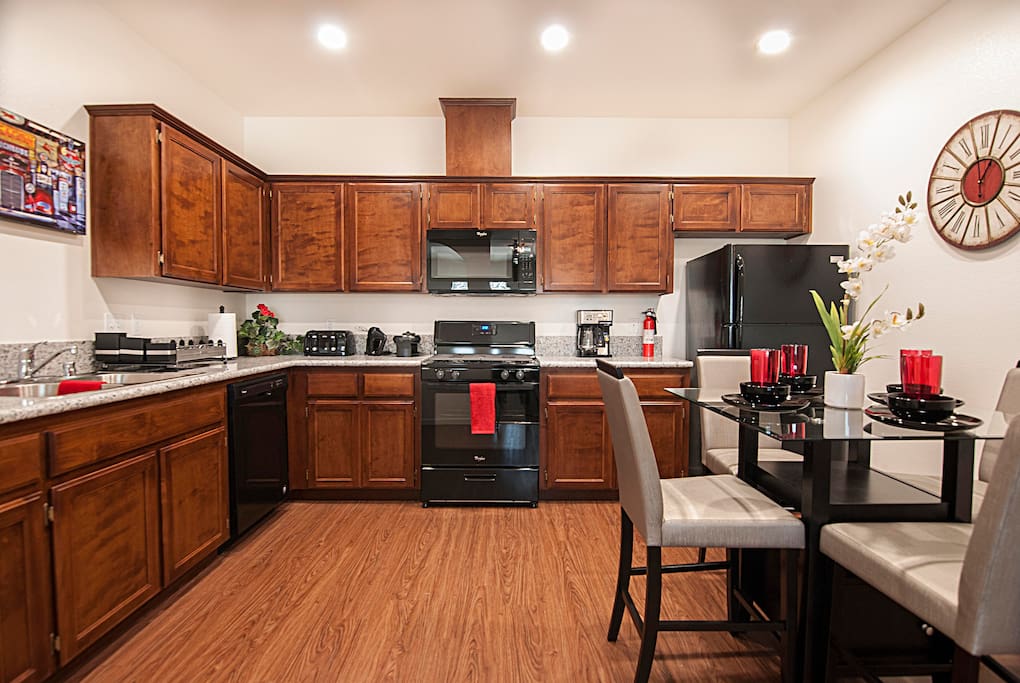 Kitchen opens to living room behind