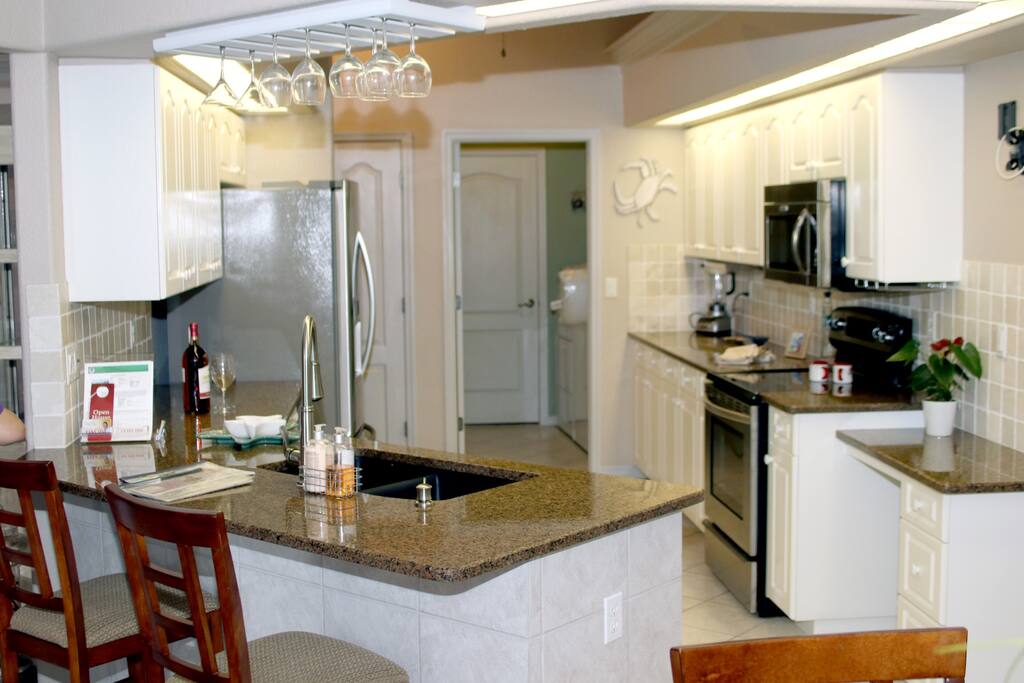 Large kitchen with Kitchen Aide stainless steel appliances.