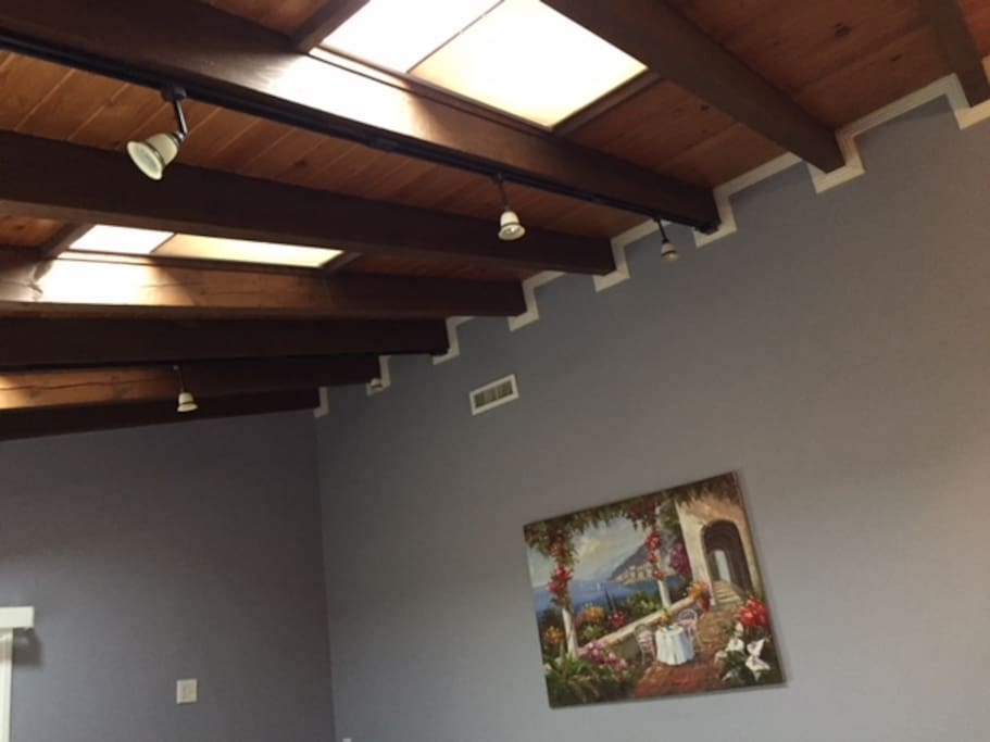 Living room has sun roof ceiling