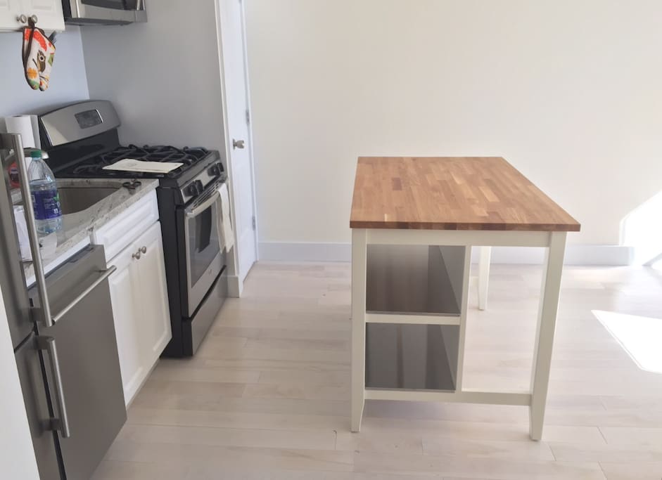 Kitchen island with chairs (not shown) is a great spot to have your complimentary coffee and plan out your day!