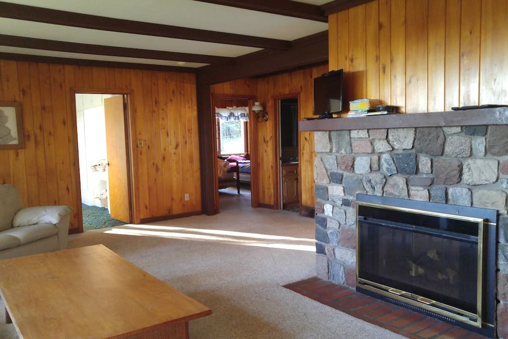 Living area with a couch, a love seat, and an arm chair.