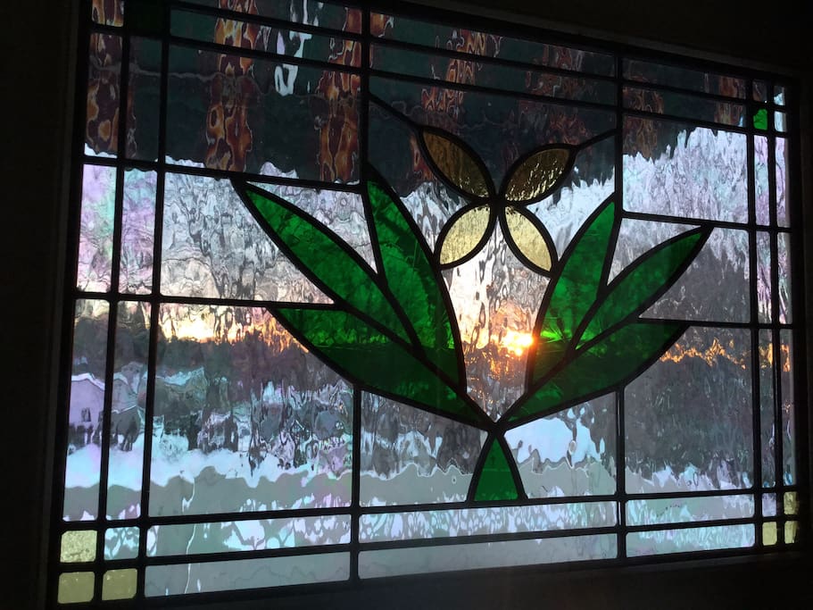 Sunrise through stained glass door.