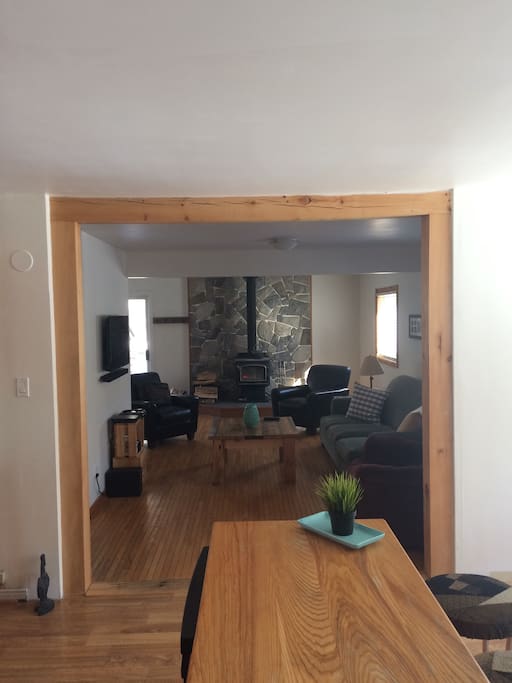 The kitchen looking in to the living room. Relax in front of the real wood stove. Wood supplied. Bell satellite, DVD player and board games for your evening entertainment.