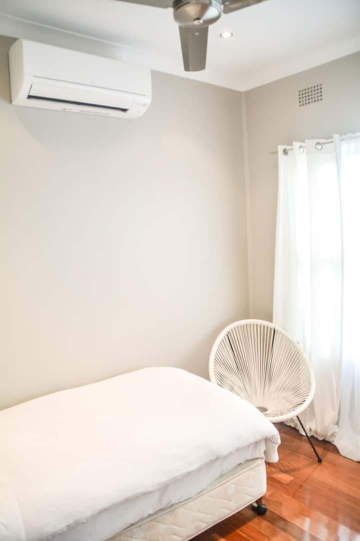 Sunny and light 3rd bedroom with air condition and ceiling fan