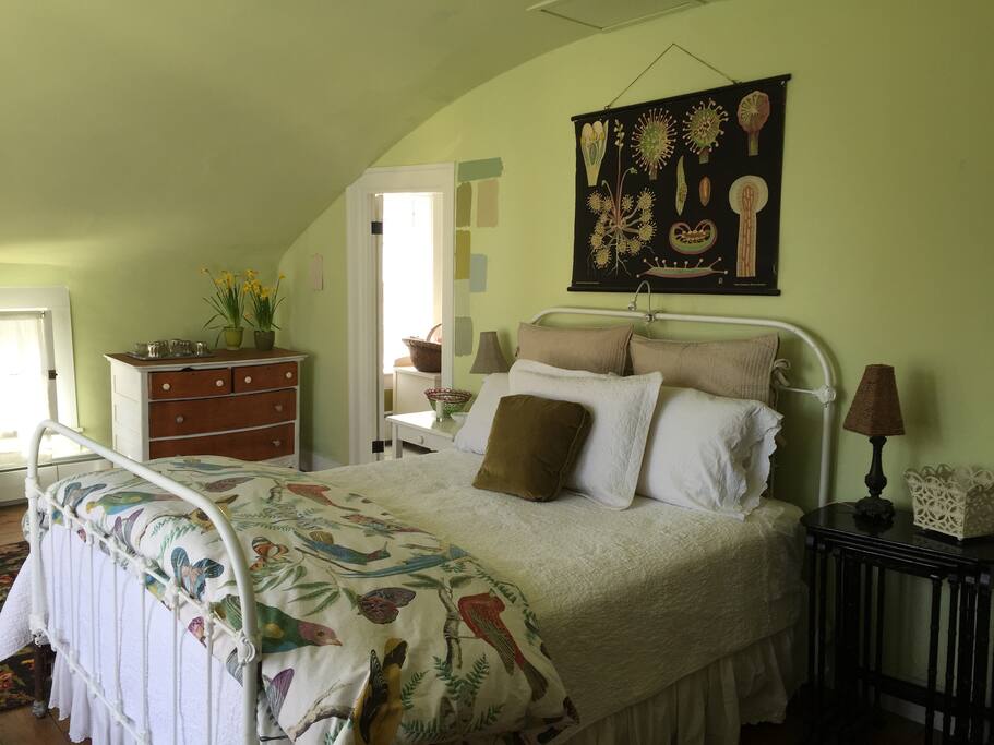 Master bedroom with queen bed and balcony overlooking beautiful and quiet Main Street.
