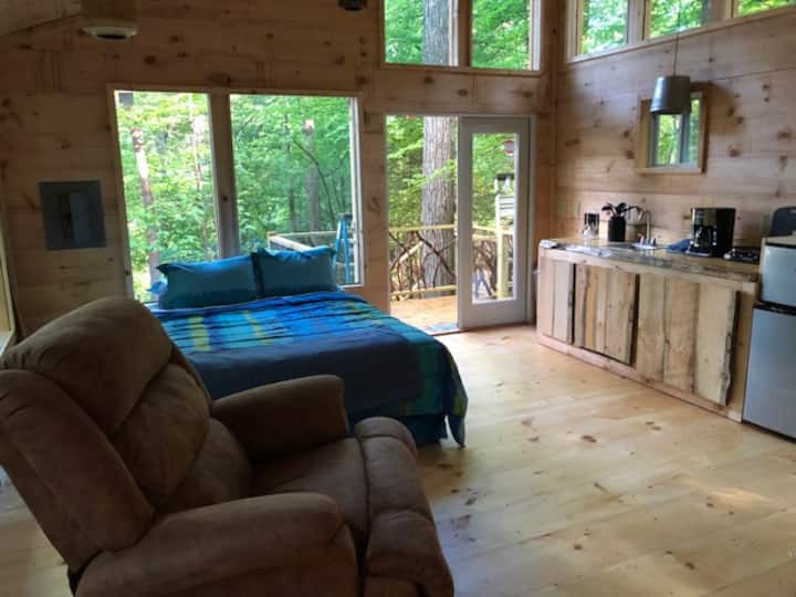 Treehouse queen bed & kitchen area