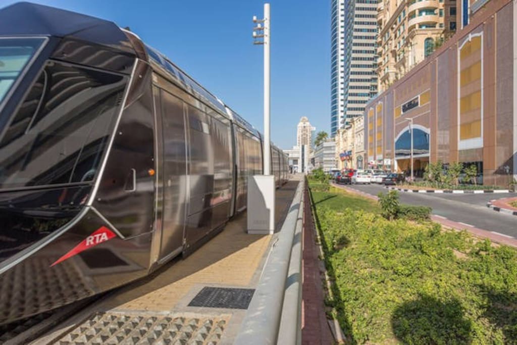 Tram next to building