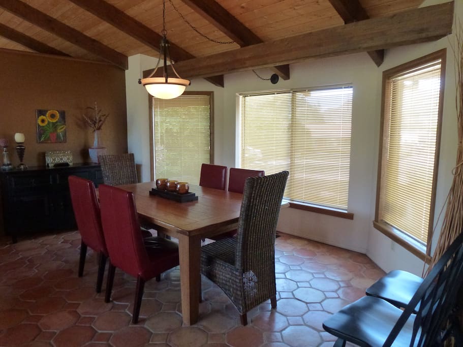 Dining Area with large table and six comfy chairs