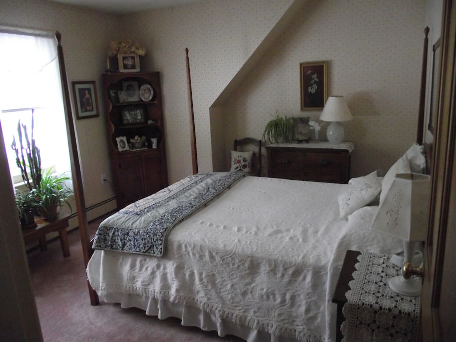 Bright bedroom with queen bed.