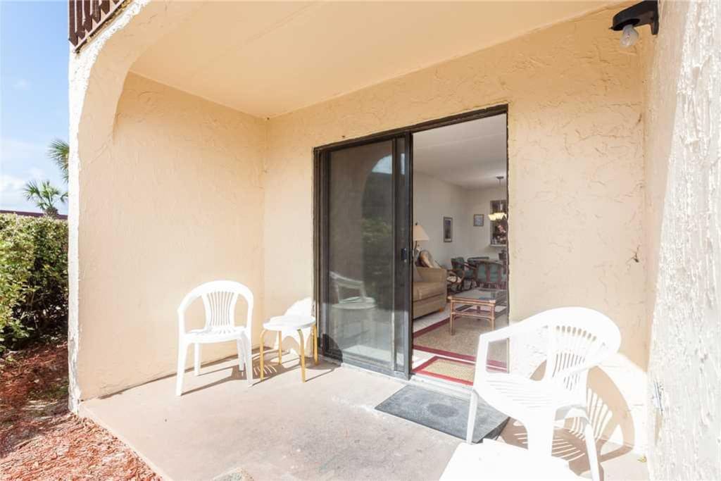 Easy Access - The living room provides quick and easy access to the patio where you can sit and enjoy the cool breeze and share s
