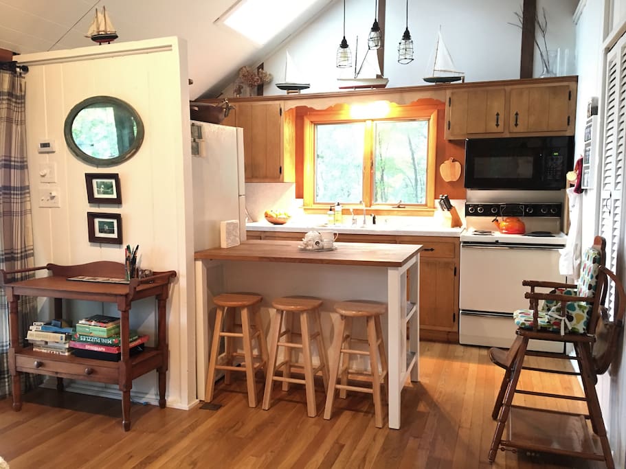 kitchen and island with 4 stools + highchair