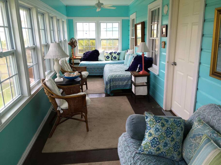 Sun porch with windows that can be opened to island breezes on three sides.