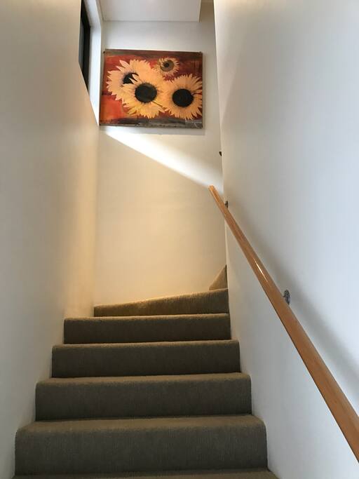Split level apartment with bedroom upstairs.