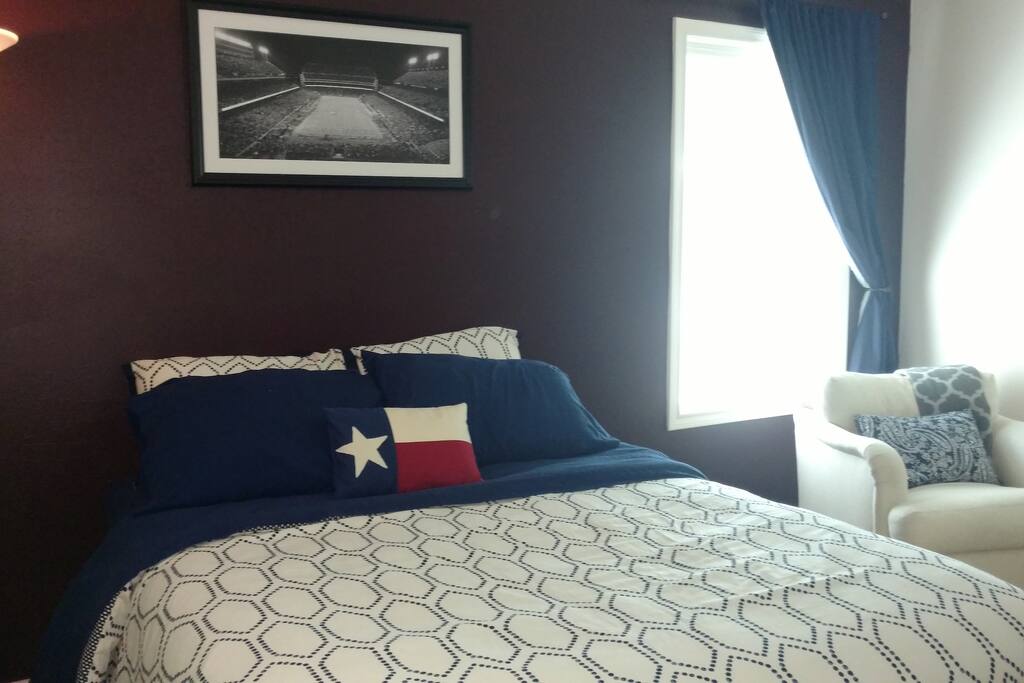 This cozy suite has a queen bed and a black out curtain for your best night's sleep away from home.