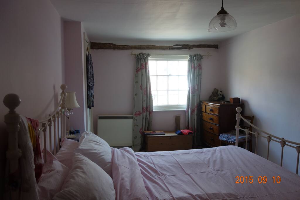 Main bedroom with large cupboard and two chests of drawers.