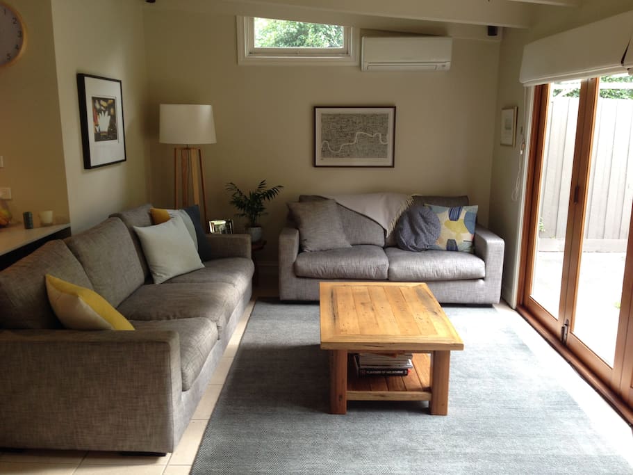 Living room with AC, TV (on wall to the right of camera)