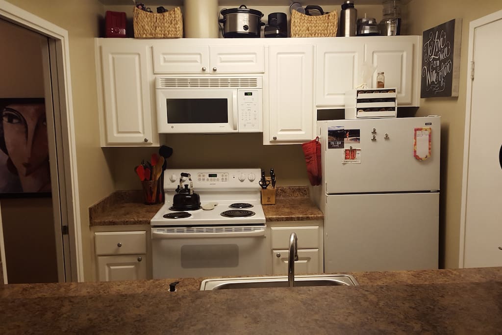 Kitchen with full-size appliances, including dishwasher.