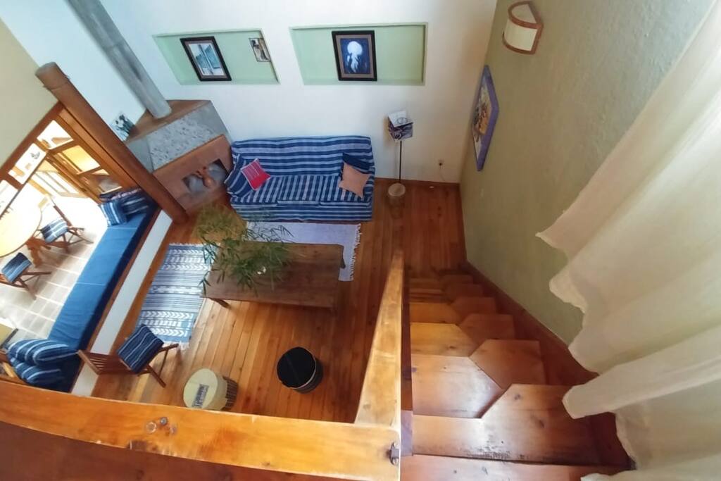 Bird's eye view of the rich, warm living room which forms the center of the home.