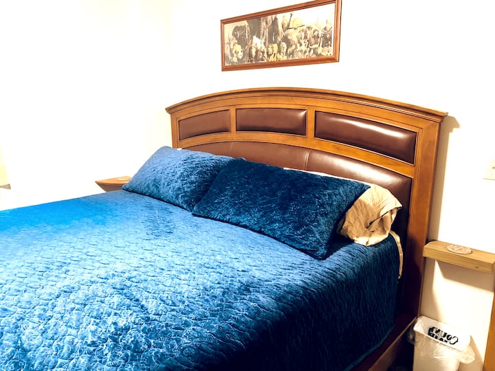 Master Bedroom with California King conturing comfort bed.
