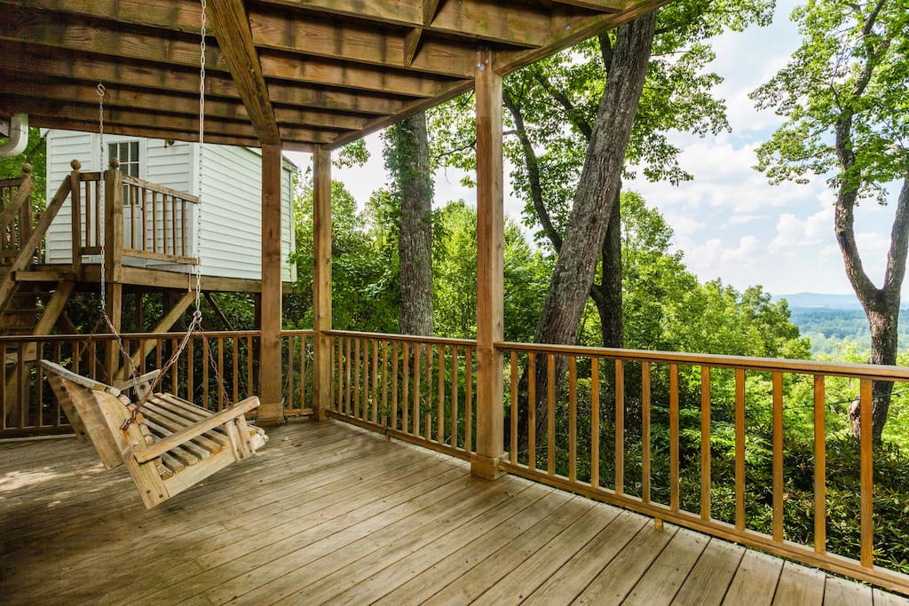 Your deck. Since this photo was taken, the much loved porch swing retired. We've replace with a different kind of swing. There is also a table and chairs.