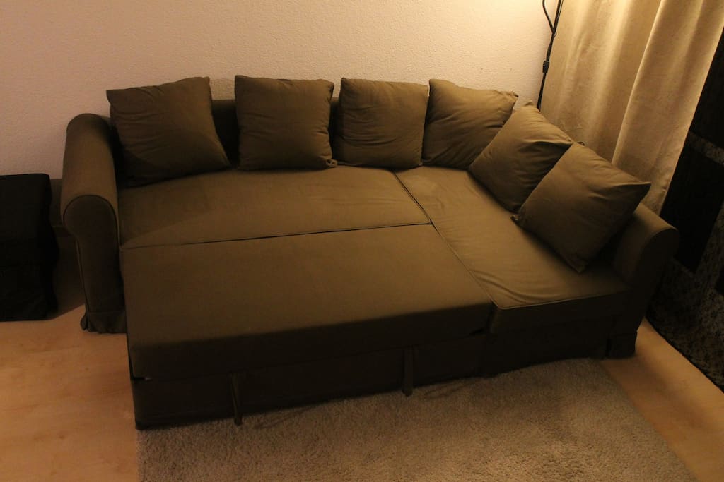 Large couch easily fitting two people.