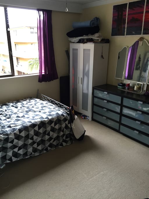 Double bed with closet and chest of drawers