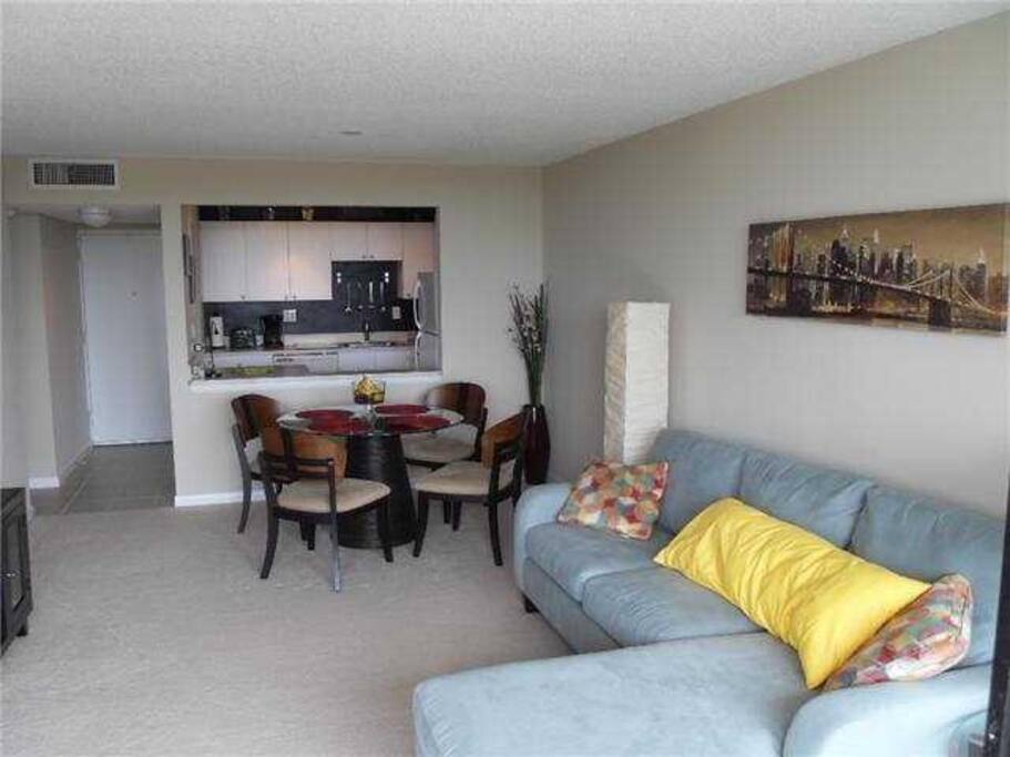 Open concept Kitchen/ Living room and dining . Sleeper sofa.