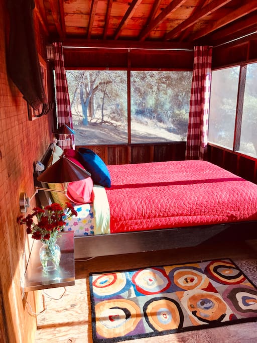 Sleep in the screened in porch overlooking the river.