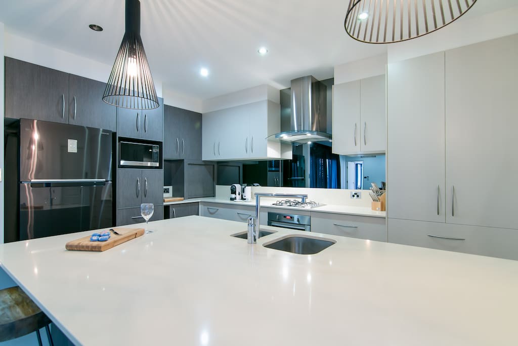 Indoor kitchen- microwave,coffee maker,gas cooking
large ceaser-stone bench space with air-conditioning