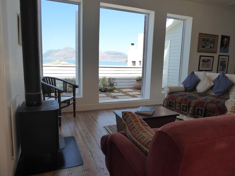 The main living area opens onto a balcony with sea views across to Simon's Town on the other side of the bay.