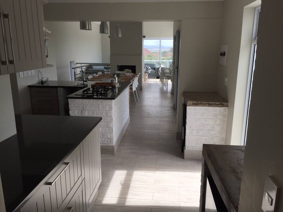 Open plan, ideal for indoor/outdoor entertaining - barbeque. Relax on sun deck and terraced lawns overlooking golf course and Kromme river