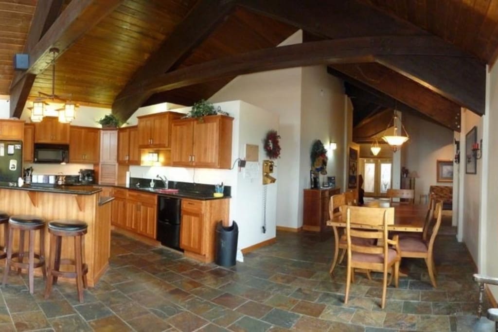Full size kitchen and dining with kitchen bar eating area