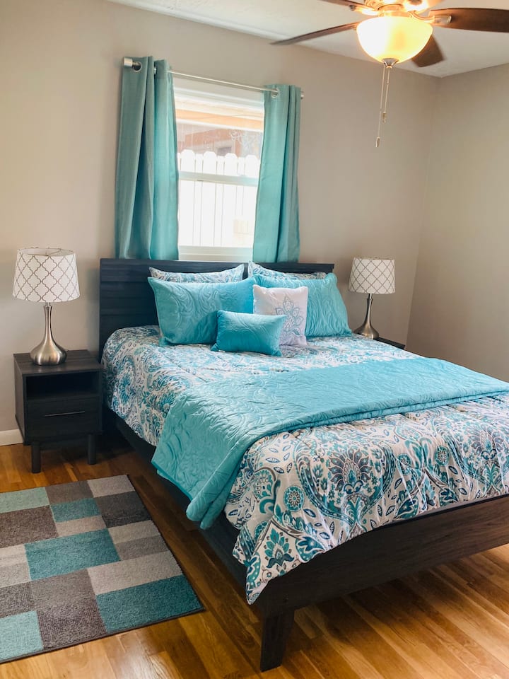 Bedroom two has a comfy queen size bed, a chest of drawers, and a very spacious closet. 