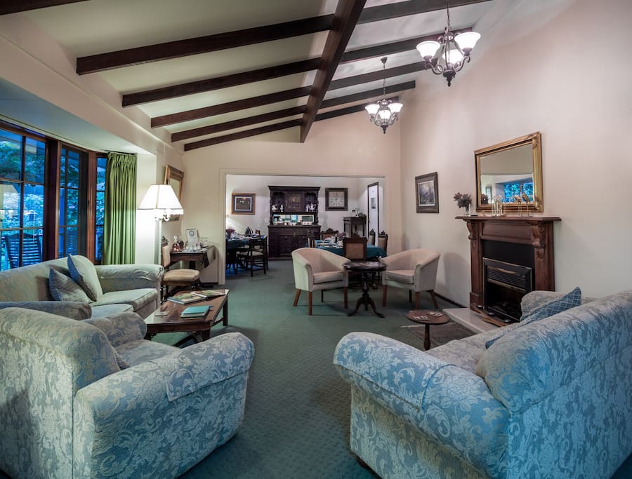 Our comfortable guest lounge and dining room with access to the front deck!