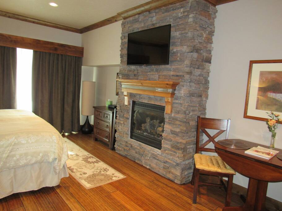 Stone fireplace - flat screen satellite TV