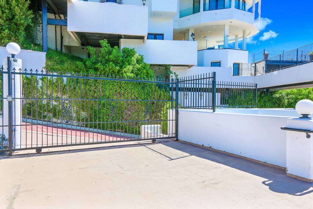 Private gate entrance with parking