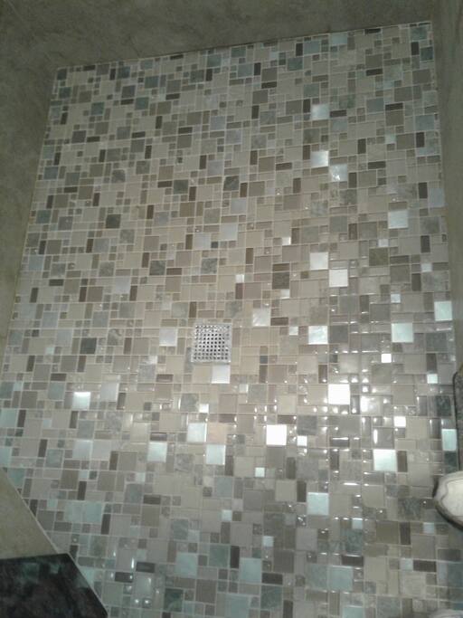 Custom Shower with dual Rain heads and Skylight and Heated Floors