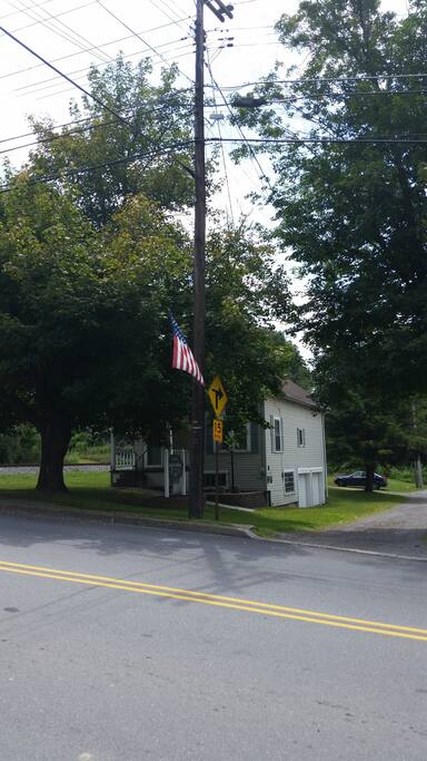 View of front of house from across the street in town.