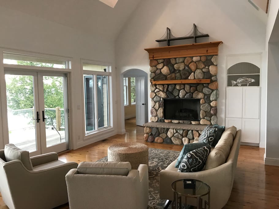 Fireplace, 32" TV in the cabinet and great lake views - looking from the kitchen.