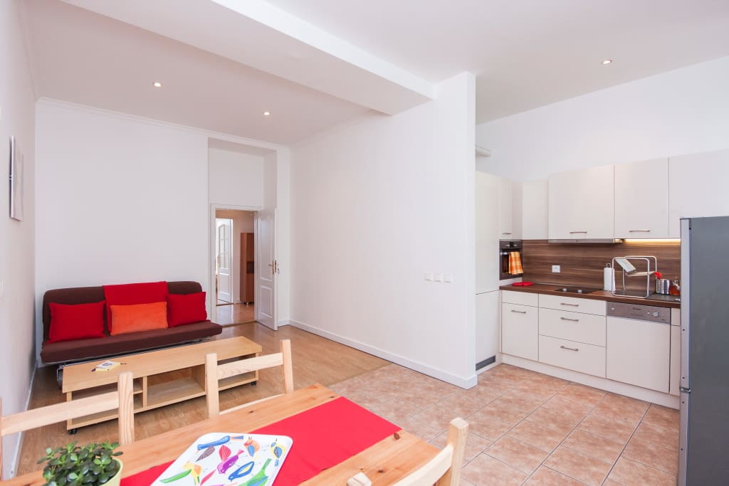 There is also sofa in the kitchen