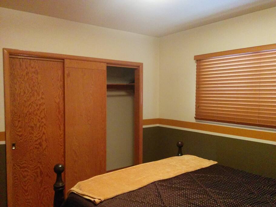 Large closet. Window has view of terraced back yard and green space.