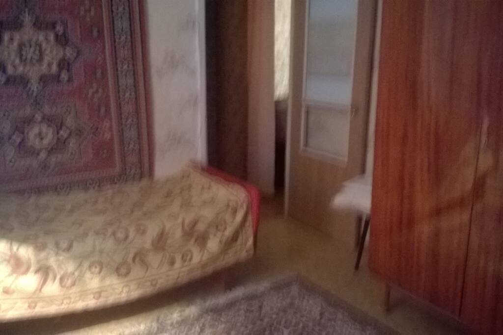 Passage room with wardrobe and single bed for another guest