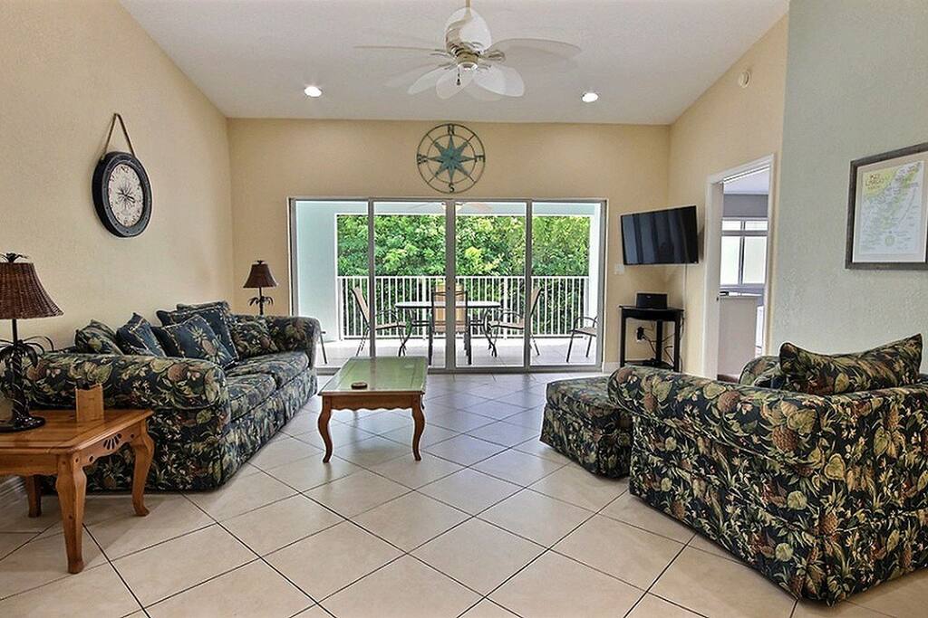 Open concept living area with queen sleeper sofa