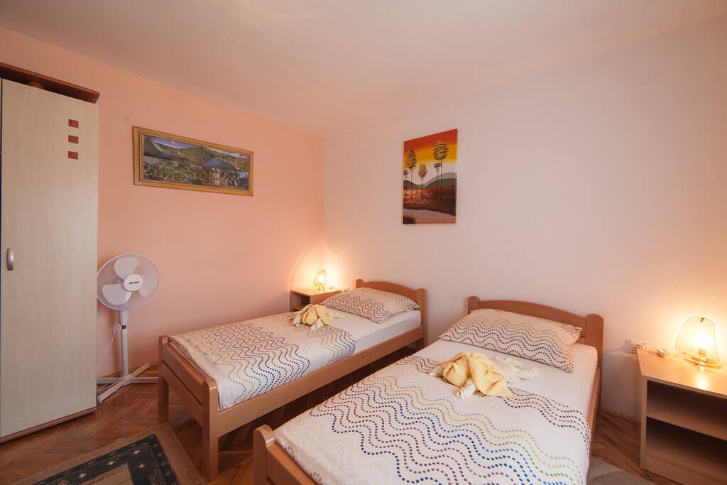 Room with two single beds