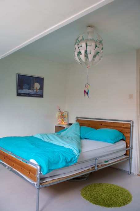 Main bed room with self-made bed and spacious setup