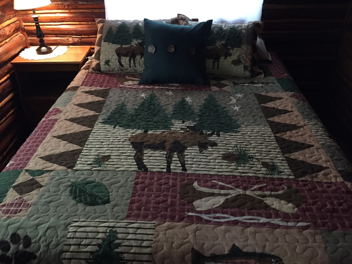 Your queen bed is comfy! There is also a full futon and a single cot to comfortably sleep five. A little one could also sleep on the loveseat if needed.