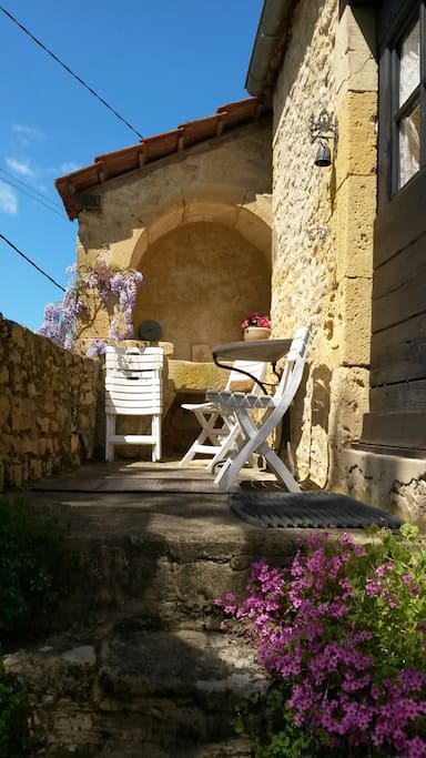 Sunny terrace overlooking lane and fields
