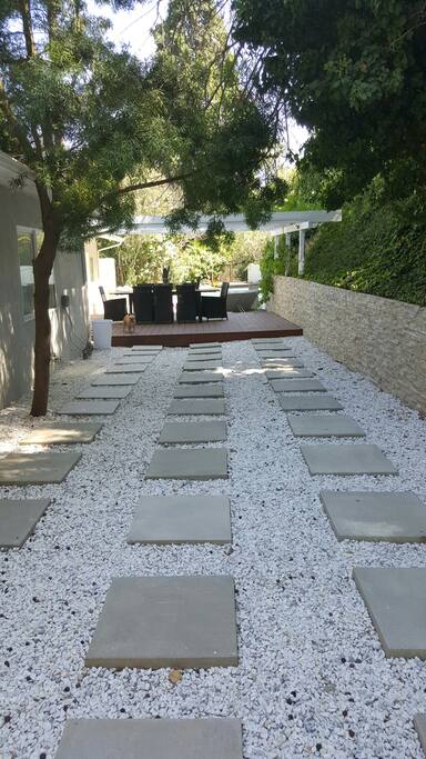 PEACEFUL WALKWAY LEADING FROM POOL AREA TO BACK PATIO