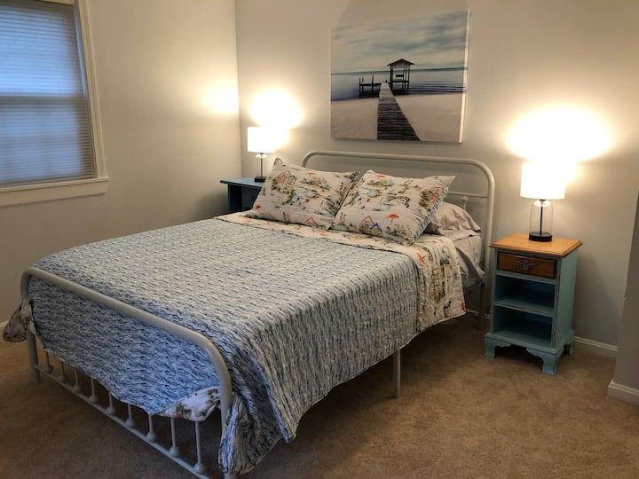 Master bedroom features a brand new mattress and plenty of lighting for late night book reading. 